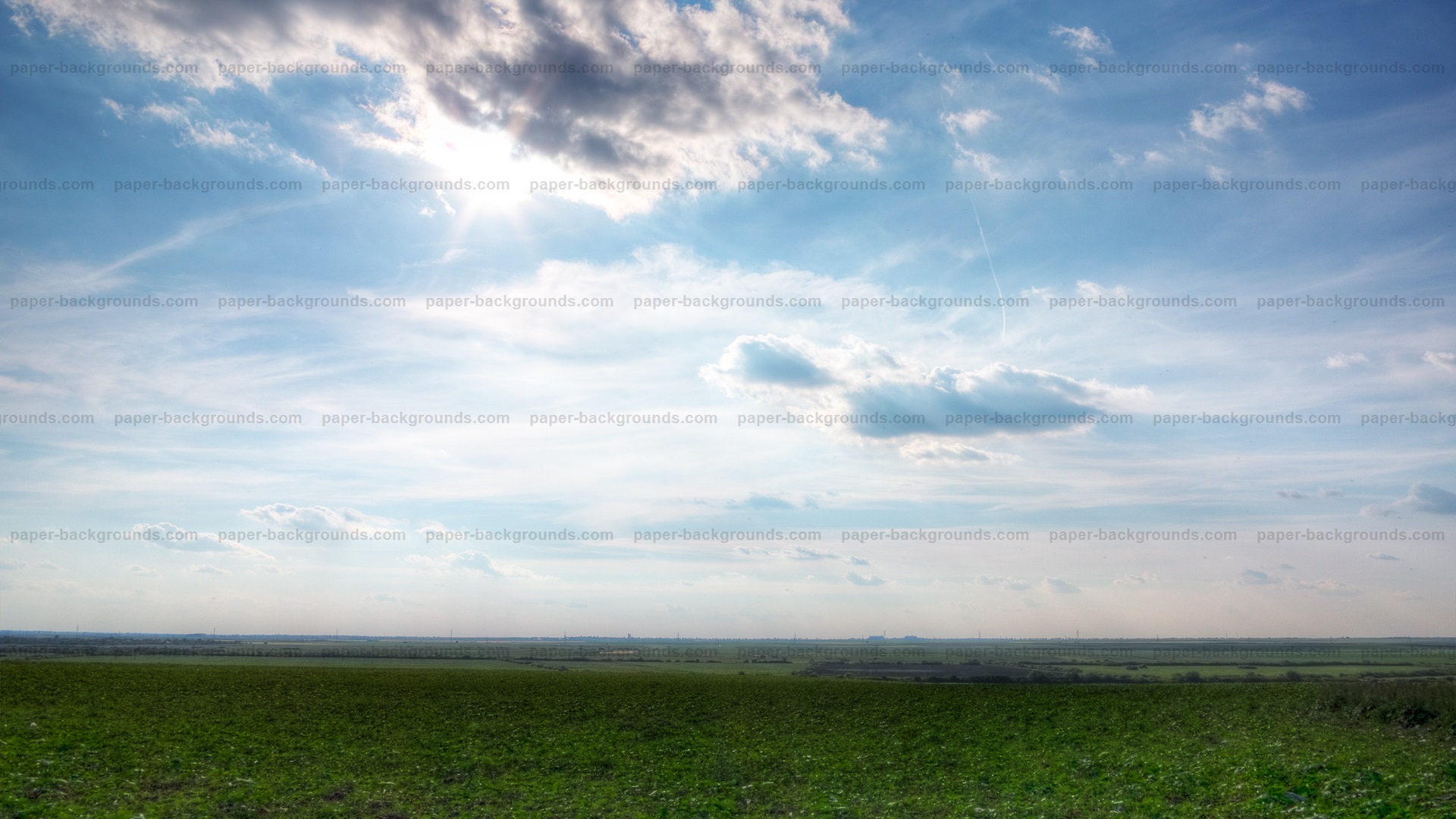 Green Grass with Blue Sky and Clouds